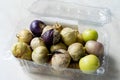 Tomatillos, green tomatoes, with salsa verde, green sauce, in a molcajete, traditional Mexican mortar Royalty Free Stock Photo