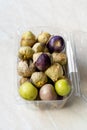 Tomatillos, green tomatoes, with salsa verde, green sauce, in a molcajete, traditional Mexican mortar Royalty Free Stock Photo