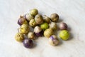 Tomatillos, green tomatoes, with salsa verde, green sauce, in a molcajete, traditional Mexican mortar Royalty Free Stock Photo