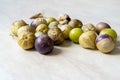 Tomatillos, green tomatoes, with salsa verde, green sauce, in a molcajete, traditional Mexican mortar Royalty Free Stock Photo