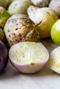 Tomatillos, green tomatoes, with salsa verde, green sauce, in a molcajete, traditional Mexican mortar Royalty Free Stock Photo