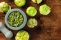 Tomatillos, green tomatoes, with salsa verde, green sauce, in a molcajete Royalty Free Stock Photo