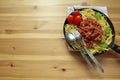 Tomato and Basil pasta cooking in a pan gourmet, homemade dish on a wooden table Royalty Free Stock Photo