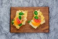 Tomato and basil summer sandwich on kitchen board Royalty Free Stock Photo