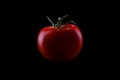 Tomato on black background Royalty Free Stock Photo