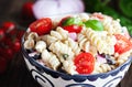 Tomato, Black Olive, and Feta, Pasta Salad with Freshly Chopped Basil Leaves Royalty Free Stock Photo