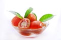 Tomato in bowl isolated on white Royalty Free Stock Photo
