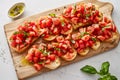 tomato bruschetta topped with fresh basil on crispy bread Royalty Free Stock Photo