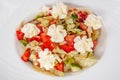 Tomato and cabbage salad with marinated feta cheese and toast