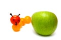 Tomato caterpillar with a green apple Royalty Free Stock Photo