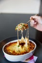 Tomato cheese risotto with spoon melting cheese in the kaiseki fine dining Japanese restaurant