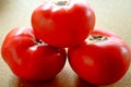 red tomatoes on a table.fresh tomatoes isolated on cork background Royalty Free Stock Photo