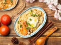 with tomato and chopsticks served in dish on wooden table top view of chines food Royalty Free Stock Photo