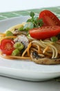 Tomato and colored spaghetti with mushroom Royalty Free Stock Photo