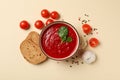 Tomato cream soup on beige background