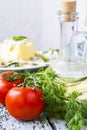 Tomato, dill on the wooden table Royalty Free Stock Photo