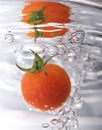 Tomato drop in water Royalty Free Stock Photo