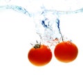 Tomato drop in water Royalty Free Stock Photo