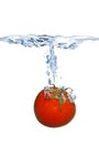 Tomato falling into the water Royalty Free Stock Photo