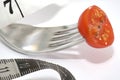 Tomato fork and tape measure Royalty Free Stock Photo