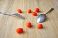 Tomato and fork on a wooden background