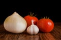 Tomato, garlic and onion close-up table top Royalty Free Stock Photo