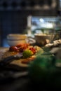 Tomato with green and red hot pepper on a chopping board, ready to be cooked in a delicious meal from sri-lanka Royalty Free Stock Photo