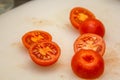 tomato halves isolated. Fresh small cherry tomatoes, mini organic cocktail tomate slice on white background Royalty Free Stock Photo