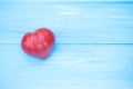 Tomato heart on a blue table.