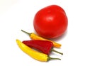 Tomato and hot peppers on white background Royalty Free Stock Photo