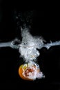 Tomato immersed in water, on black background Royalty Free Stock Photo