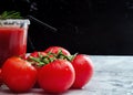 Tomato juice garnished with a rosemary branch and fresh ripe red cherry tomatoes Royalty Free Stock Photo