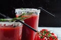 Tomato juice garnished with a rosemary branch and fresh ripe red cherry tomatoes Royalty Free Stock Photo