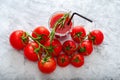 Tomato juice garnished with a rosemary branch