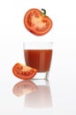 Tomato juice in glass isolated on white Royalty Free Stock Photo