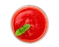 Tomato juice in glass with a mint leaf isolated on white background. Top view. Flat lay Royalty Free Stock Photo