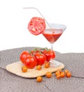 Tomato juice in the glass, orange cherry tomatoes and red tomato Royalty Free Stock Photo