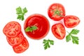 Tomato juice in glass and tomatoes with parsley leaves isolated on white background. Top view. Flat lay Royalty Free Stock Photo