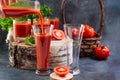 Tomato juice. A hand pours tomato juice into a glass. Royalty Free Stock Photo
