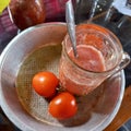 Tomato juice whose main ingredients are white sugar tomatoes and ice cubes