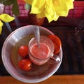 Tomato juice whose main ingredients are white sugar tomatoes and ice cubes