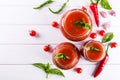 Tomato ketchup sauce with cherry tomatoes and red hot chili peppers, garlic and herbs in a glass jar Royalty Free Stock Photo