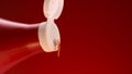 Tomato ketchup is squeezed from a red bottle with white lid. Stock footage. Close up of a drop of tomato sauce falling