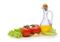 Tomato, lettuce salad and jug of vegetable oil isolated Royalty Free Stock Photo