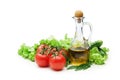 Tomato, lettuce salad and jug of vegetable oil Royalty Free Stock Photo