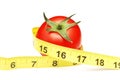 Tomato and measuring tape Royalty Free Stock Photo