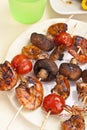 Tomato, mushroom and king prawn kebabs