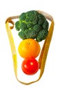 Tomato, orange, broccoli and measuring tape isolated