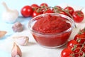 Tomato paste on the table top view. Tomato sauce.