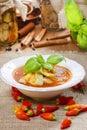 Tomato and pepper soup in white plate. Royalty Free Stock Photo